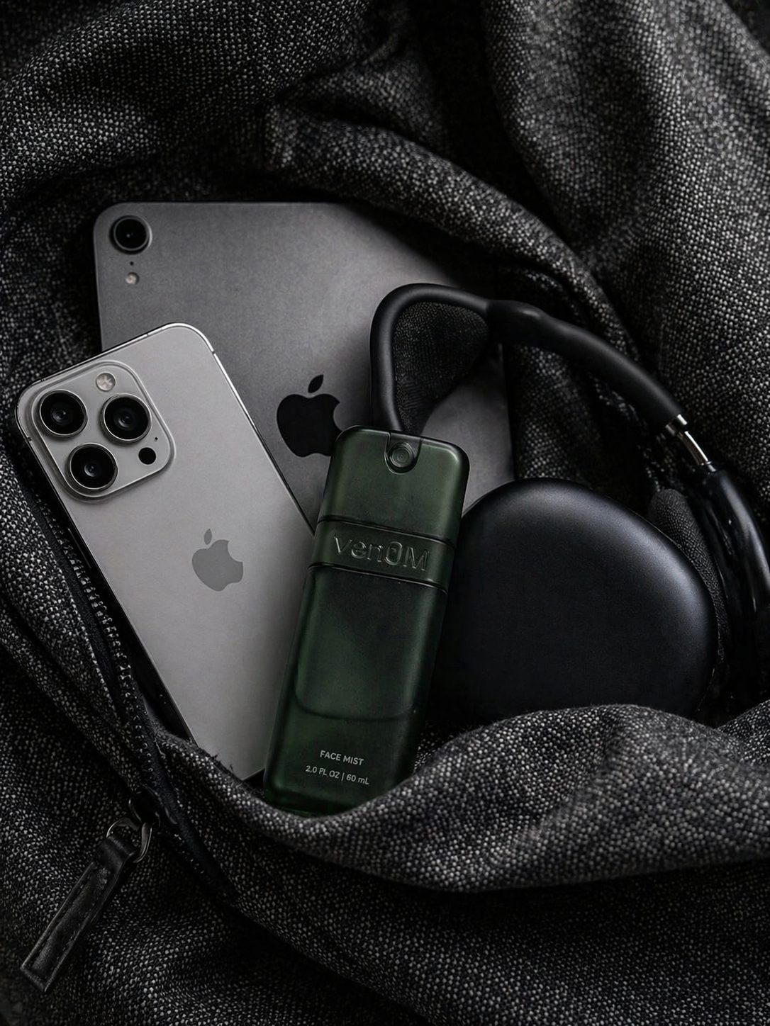 Venom mist packed with headphones and a phone